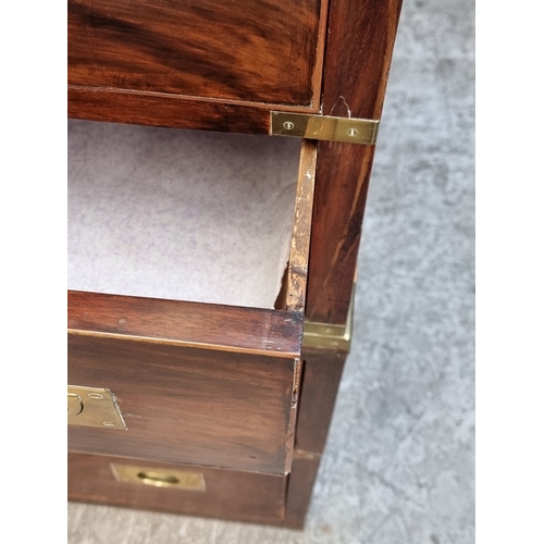 1039 - A 19th century mahogany and brass bound campaign style chest of drawers, in two parts, with counters... 
