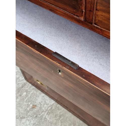 1039 - A 19th century mahogany and brass bound campaign style chest of drawers, in two parts, with counters... 