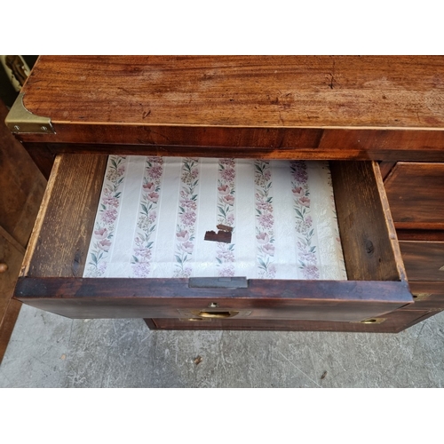 1039 - A 19th century mahogany and brass bound campaign style chest of drawers, in two parts, with counters... 