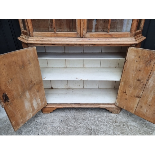 1000 - An antique pine bookcase, 143cm wide.