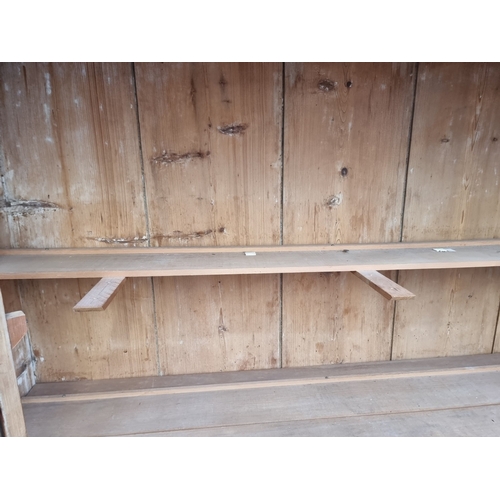 1000 - An antique pine bookcase, 143cm wide.