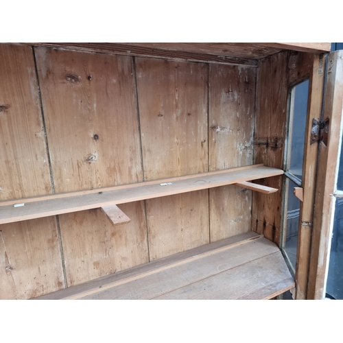 1000 - An antique pine bookcase, 143cm wide.