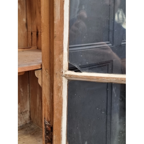 1000 - An antique pine bookcase, 143cm wide.