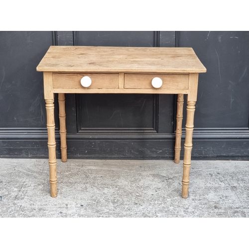1006 - A Victorian pine two drawer side table, on simulated bamboo legs, 82cm wide.