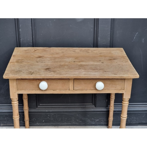 1006 - A Victorian pine two drawer side table, on simulated bamboo legs, 82cm wide.