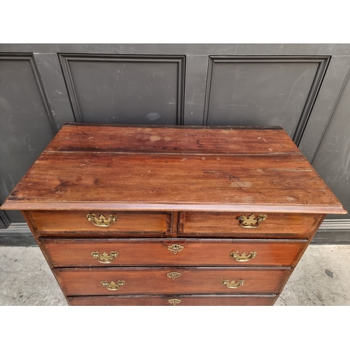 1007 - A George III mahogany and crossbanded chest of drawers, 97cm wide, (split to top).