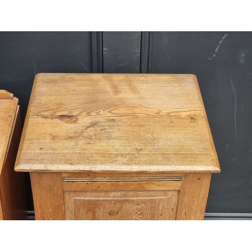1010 - A late Victorian ash bedside cupboard, 39.5cm wide; together with a similar satin walnut example, (d... 