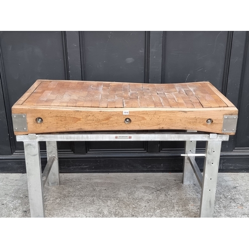 1016 - A large butchers' block, on stainless steel stand, the top 122 x 62.5cm.