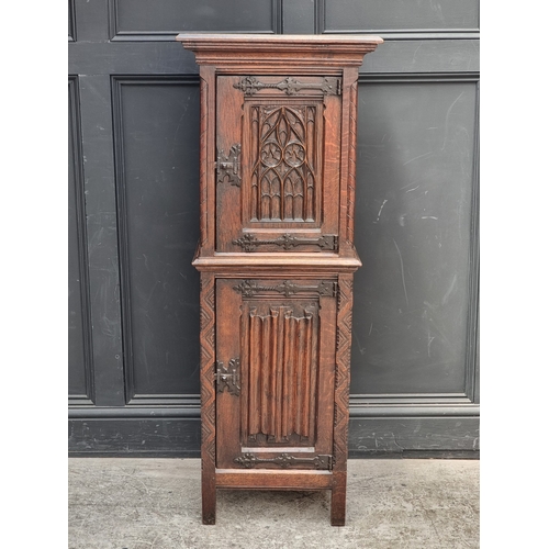 1026 - A 17th century style carved oak side cabinet,&nbsp;with&nbsp;tracery and&nbsp;linenfold panels, 132c... 