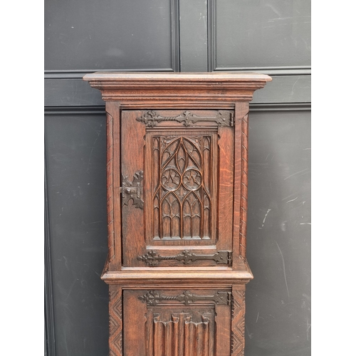 1026 - A 17th century style carved oak side cabinet,&nbsp;with&nbsp;tracery and&nbsp;linenfold panels, 132c... 