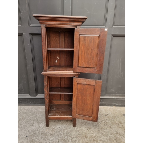 1026 - A 17th century style carved oak side cabinet,&nbsp;with&nbsp;tracery and&nbsp;linenfold panels, 132c... 