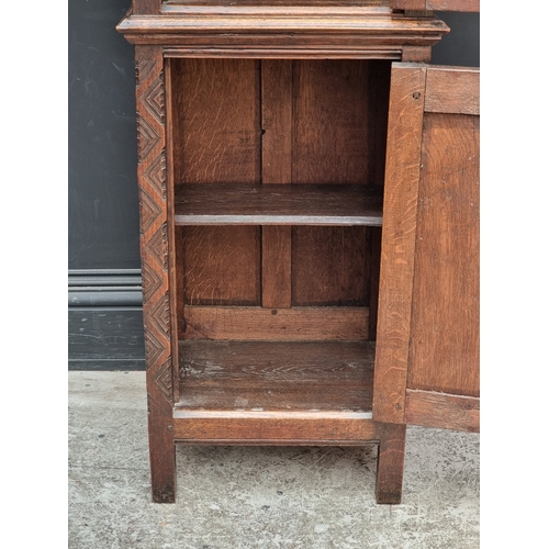 1026 - A 17th century style carved oak side cabinet,&nbsp;with&nbsp;tracery and&nbsp;linenfold panels, 132c... 