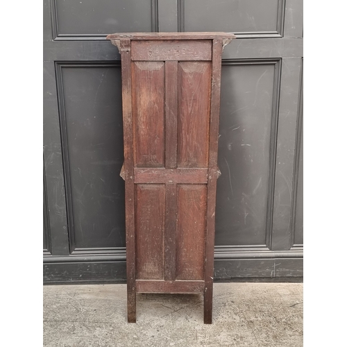 1026 - A 17th century style carved oak side cabinet,&nbsp;with&nbsp;tracery and&nbsp;linenfold panels, 132c... 