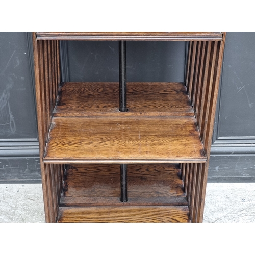 1027 - A 1920s oak revolving bookcase, 51cm wide, (formerly with additional drop leaf).