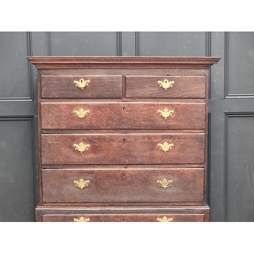 1030 - A George II oak chest on stand, 108cm wide.