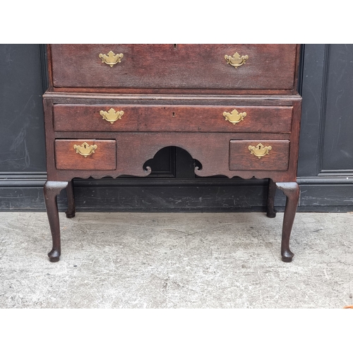1030 - A George II oak chest on stand, 108cm wide.