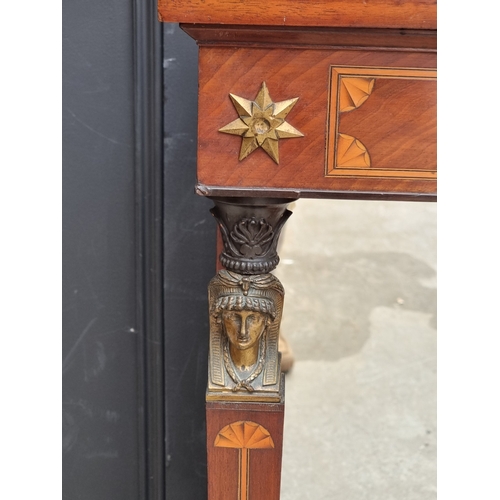 1031 - An Empire style mahogany and inlaid pier table, with mirror panel, 87.5cm wide.