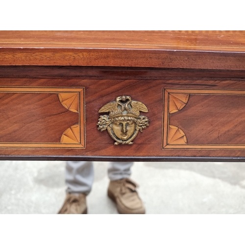 1031 - An Empire style mahogany and inlaid pier table, with mirror panel, 87.5cm wide.