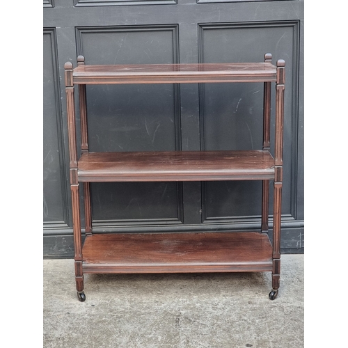 1033 - An Edwardian mahogany three tier whatnot, 91.5cm wide.