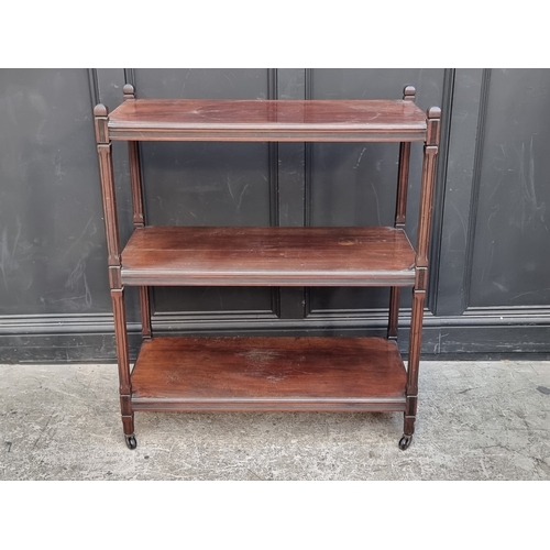 1033 - An Edwardian mahogany three tier whatnot, 91.5cm wide.