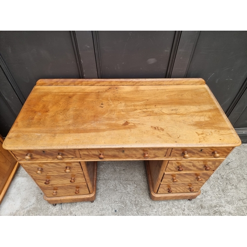 1034 - A Victorian satin birch pedestal desk, 120.5cm wide.