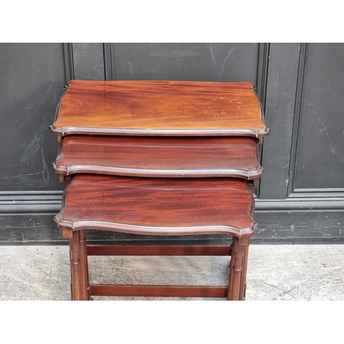 1036 - A nest of three Edwardian mahogany occasional tables, largest 56cm wide.