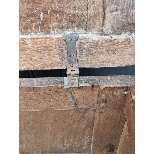 1038 - A small late 17th century oak panelled coffer, 83cm wide.
