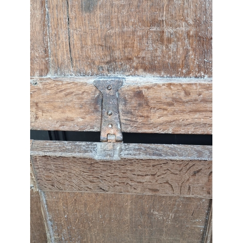 1038 - A small late 17th century oak panelled coffer, 83cm wide.
