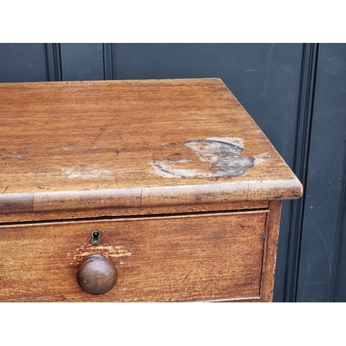 1040 - An early 19th century mahogany chest of drawers, on turned feet, 107cm wide.