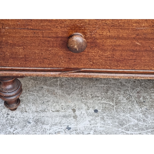 1040 - An early 19th century mahogany chest of drawers, on turned feet, 107cm wide.