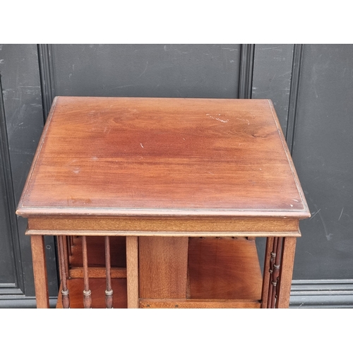 1041 - An Edwardian mahogany revolving bookcase, 49cm wide.