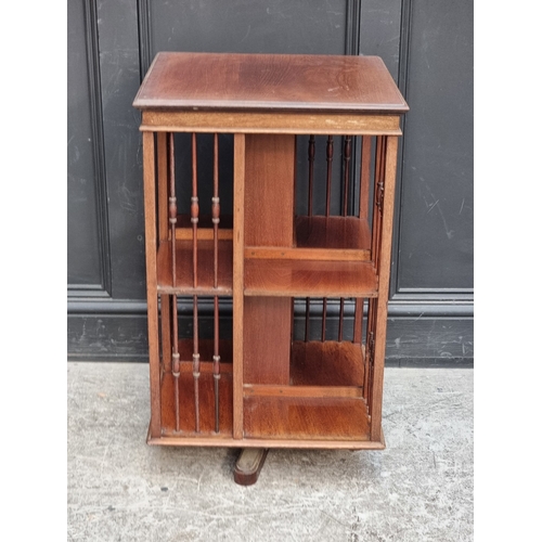 1041 - An Edwardian mahogany revolving bookcase, 49cm wide.