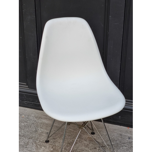 1057 - A Vitra Eames white plastic chair.