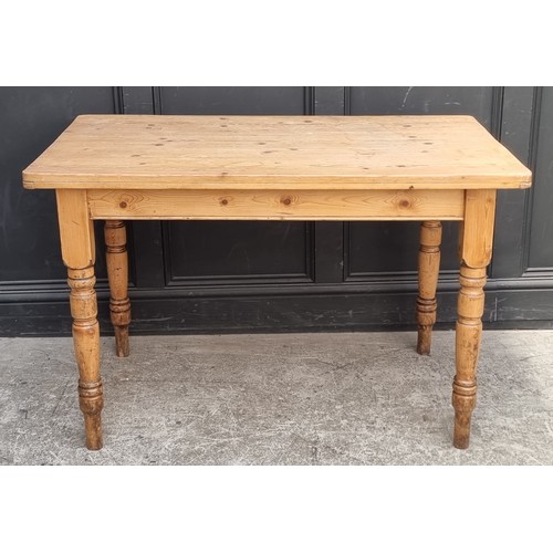 1013 - An antique pine kitchen table, with lateral frieze drawer, 120cm long.
