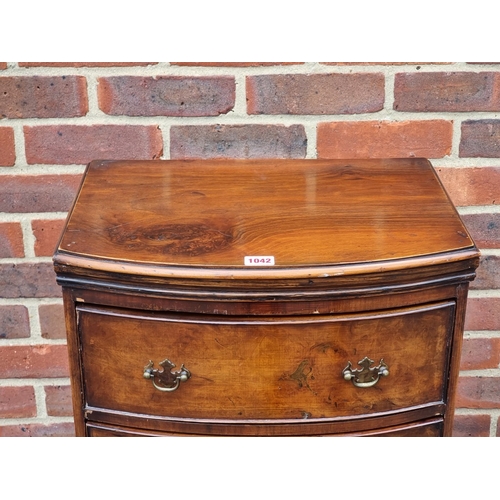 1042 - An old reproduction walnut bowfront narrow chest of drawers, 47.5cm wide.