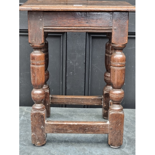 1044 - A late 17th century oak joint stool, 44.5cm wide.