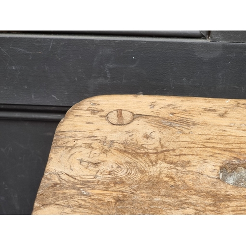 1048 - A Victorian pine and elm stool, 47cm high.