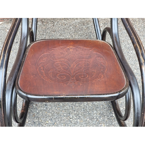 1053 - A rare Art Nouveau bentwood rocking chair, labelled 'Fischel'.