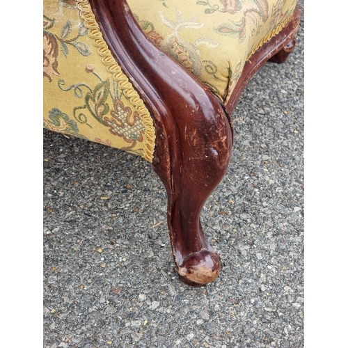 1058 - A Victorian mahogany and button upholstered occasional armchair.