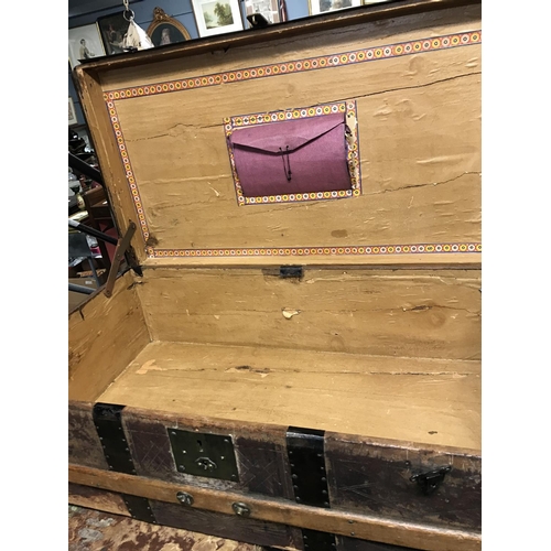 147 - Vintage wooden trunk with metal strapping