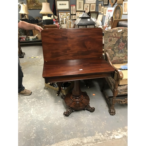 149 - Early swivel games table with ornate base