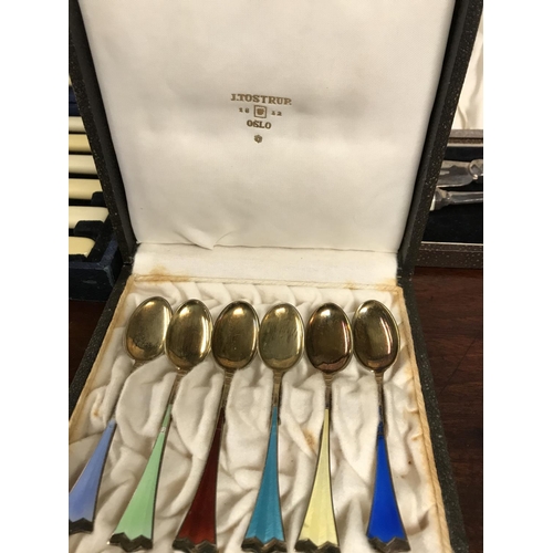 389 - Boxed set of vintage Tostrup of Norway enamel silver spoons & 2 x other sets of cutlery