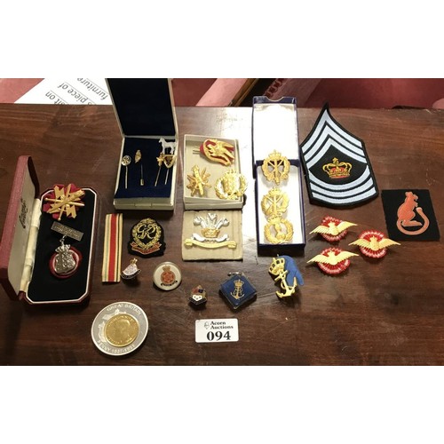 94 - Nice box of assorted military badges,german desert pin, insignia, pins etc