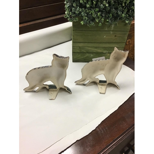 164 - Pair of metal cat doorstops