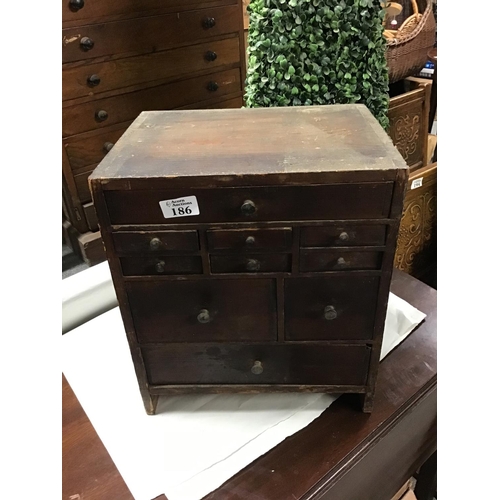 186 - Early watch makers cabinet with 10 drawers all having various watch makers tool and watch parts etc ... 