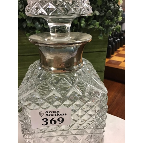 369 - Glass decanter with hallmarked silver collar