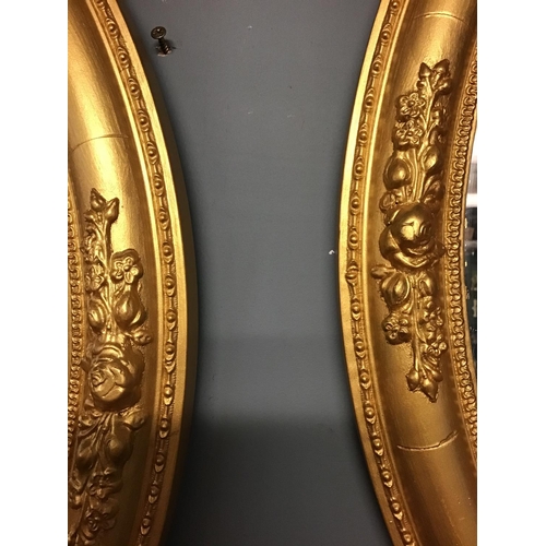 405 - Pair of gilt framed oval mirrors - 24 inches x 20 inches - COLLECTION ONLY