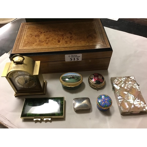 515 - Wooden cigarette box containing 4 x Pill boxes, Small carriage clock and 2 x Card cases