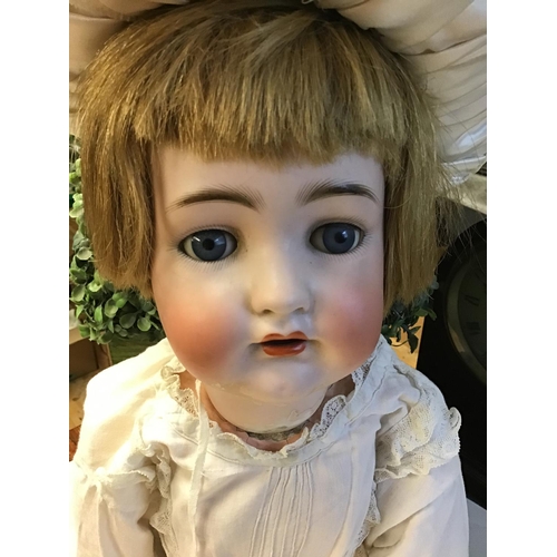 396 - Large vintage doll with jointed limbs and rocking eyes - Damage to neck and chest/back