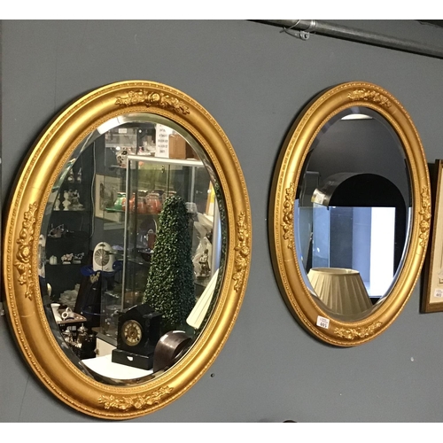 405 - Pair of gilt framed oval mirrors - 24 inches x 20 inches - COLLECTION ONLY